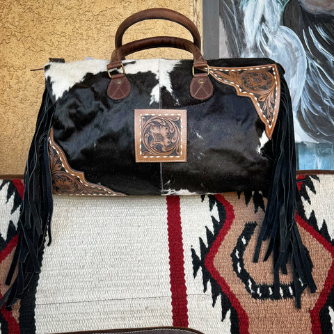 Cowhide fringed duffel